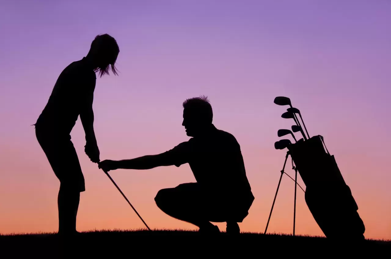golf lesson from a golf professional and instructor. Themes of the image include golf lessons, instruction, short game, sport, game, practice, teaching, learning, lesson tee, driving range, golf professional, chipping