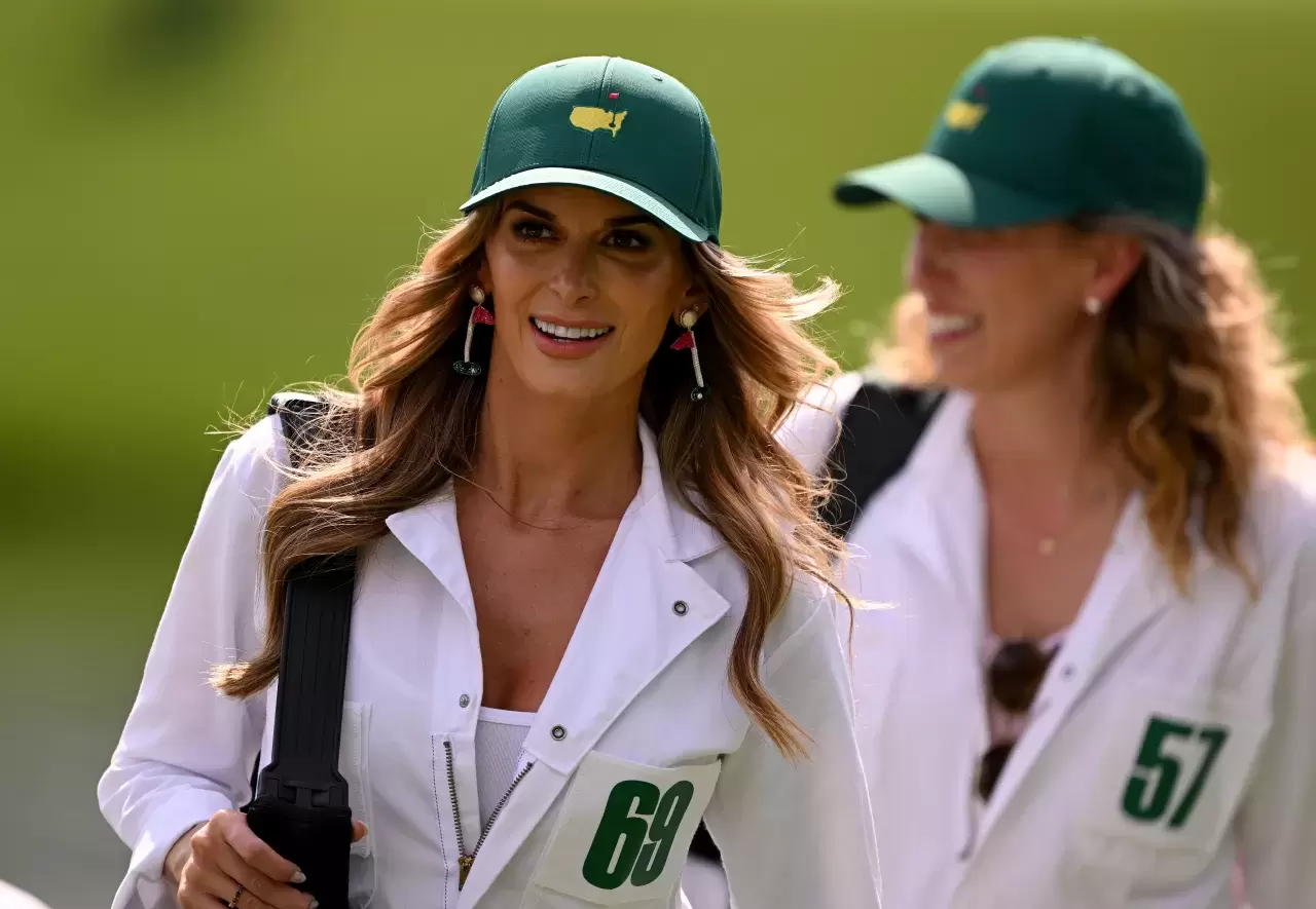 Brooks Koepka of the United States wife, Jena Sims Koepka during the Par 3 contest prior to the 2023 Masters Tournament at Augusta National Golf Club on April 05, 2023 in Augusta, Georgia